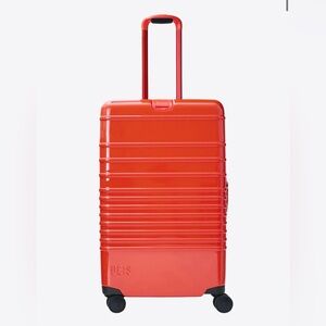 Beis Medium Check In Roller in Glossy Flame with clear luggage cover